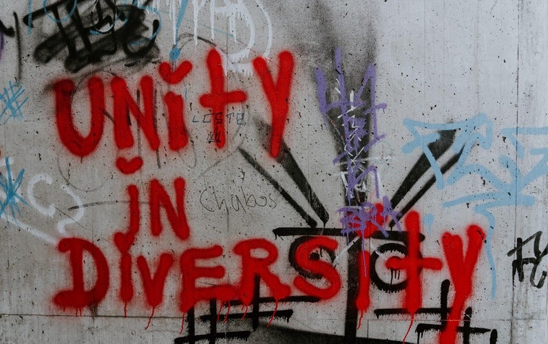 Unity in Diversity graffiti on wall